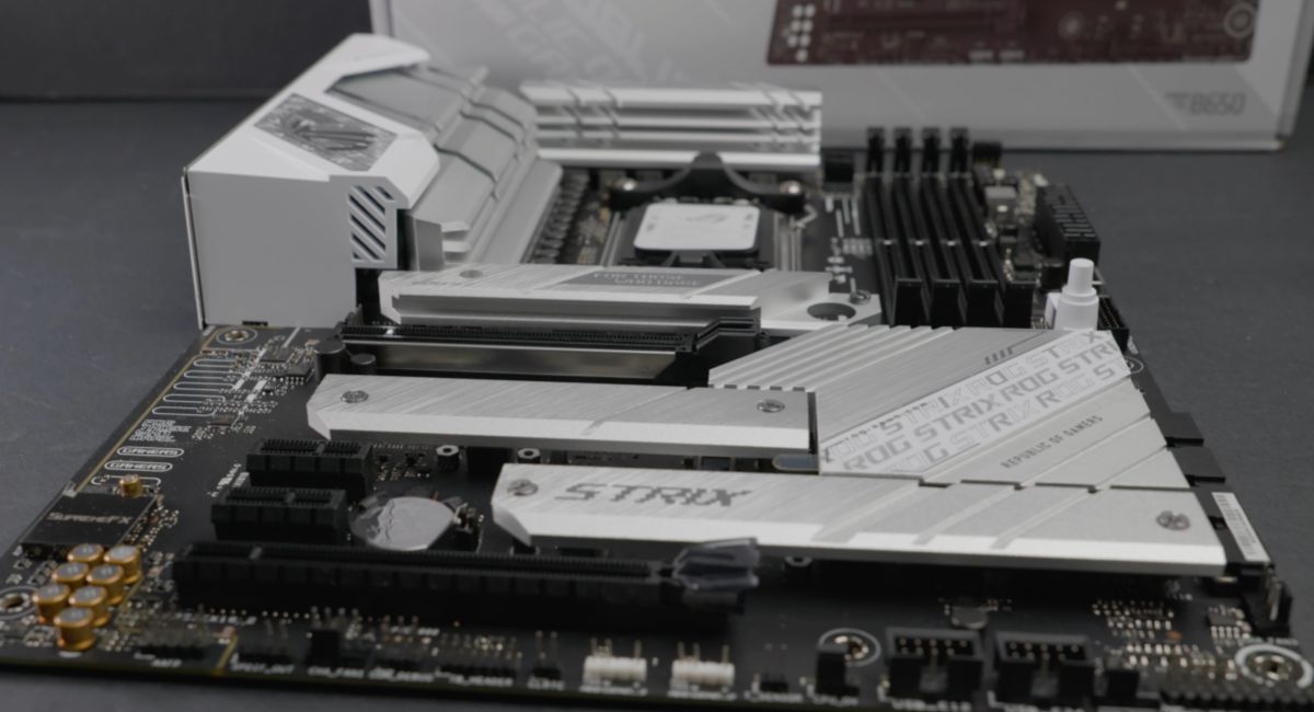 ASUS ROG STRIX B650-A motherboard BIOS update process showing EZ Flash utility, USB drive setup, and BIOS interface for safe firmware installation and system stability.